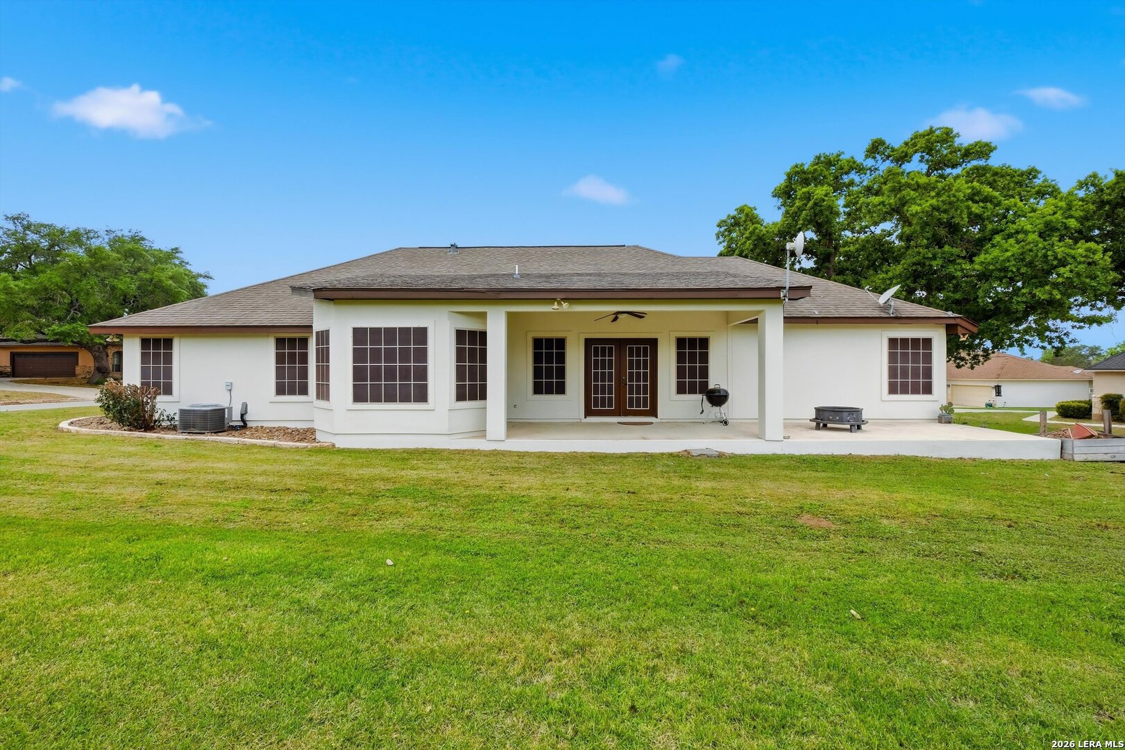 101 Lynx Circle Devine, TX 78016 - Photo 36 of 36 a front view of a house with a garden