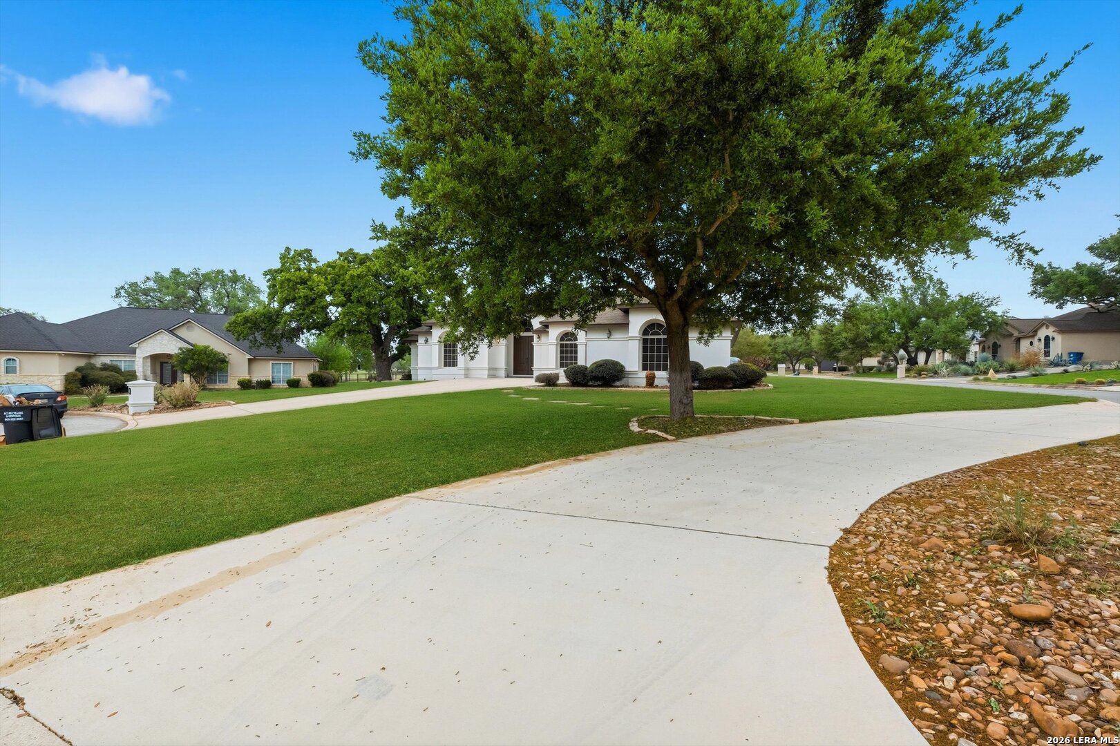 101 Lynx Circle Devine, TX 78016 - Photo 5 of 36 a view of a park with large trees