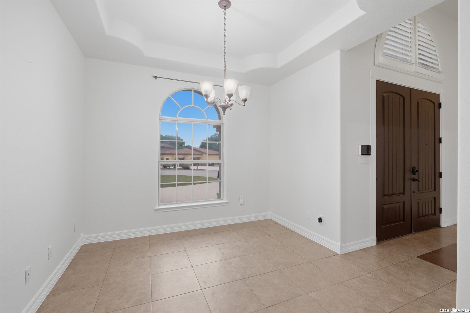 101 Lynx Circle Devine, TX 78016 - Photo 10 of 36 a view of a room with window and chandelier