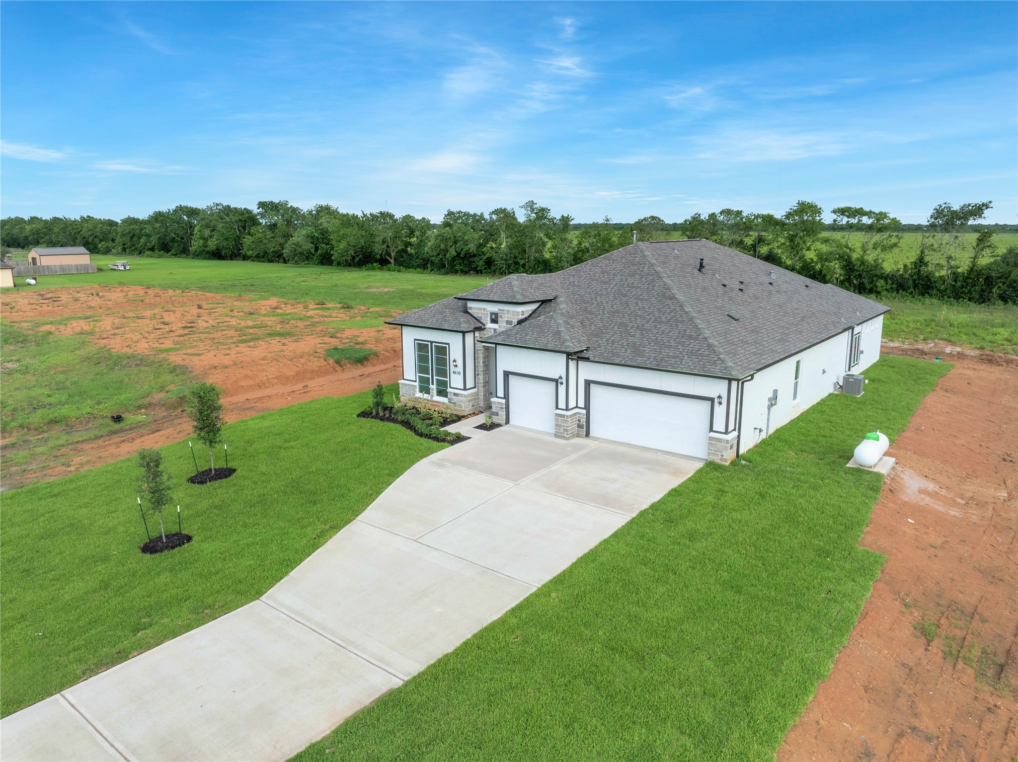 4610 Magnolia Bend Drive Rosharon, TX 77583 - Photo 42 of 48 a aerial view of a house next to a yard and lake view