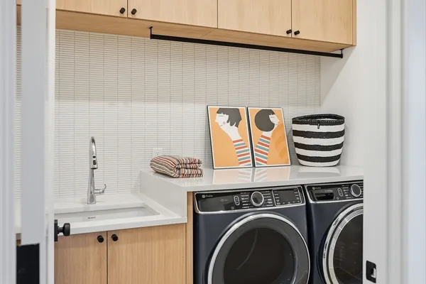 a view of storage and utility room with washer and dryer