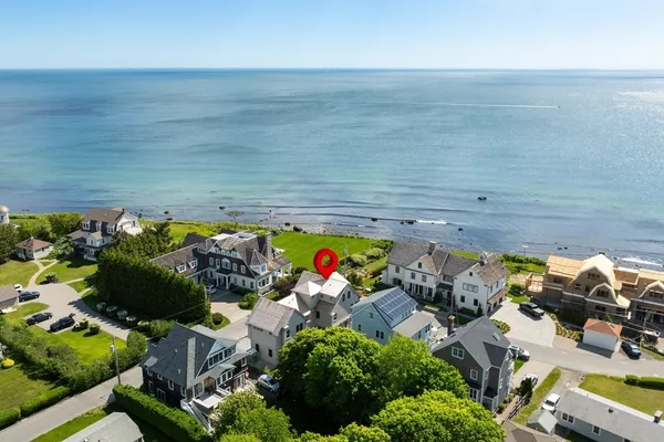an aerial view of a house with a yard