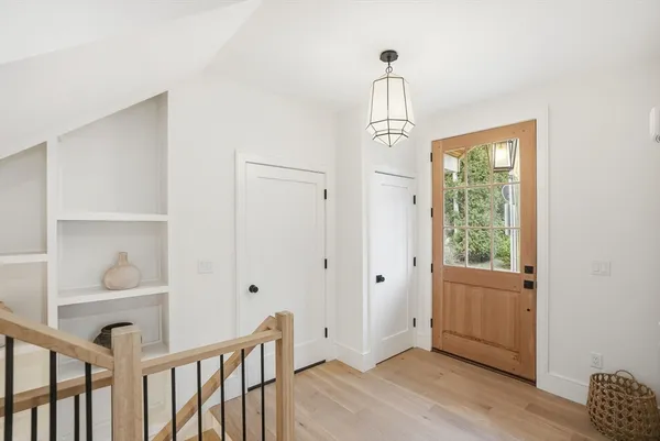 a view of entryway with wooden floor