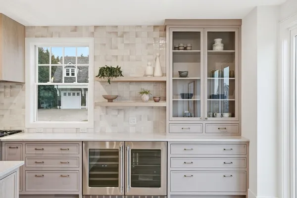 a kitchen with cabinets and window