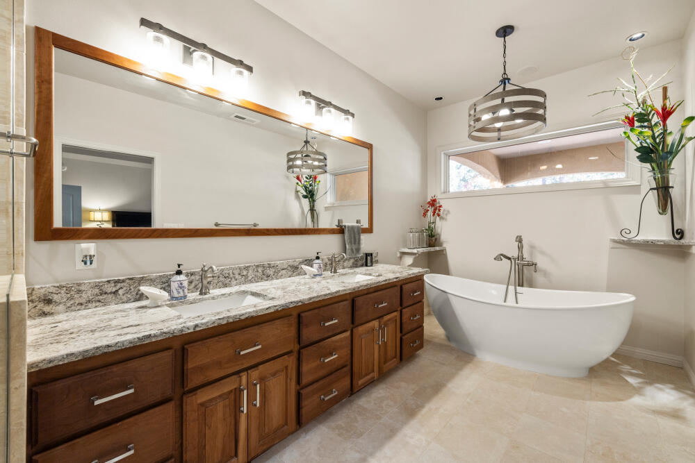 11629 Merganser Road Klamath Falls, OR 97601 - Photo 40 of 50 a spacious bathroom with a double vanity sink double mirror and bathtub