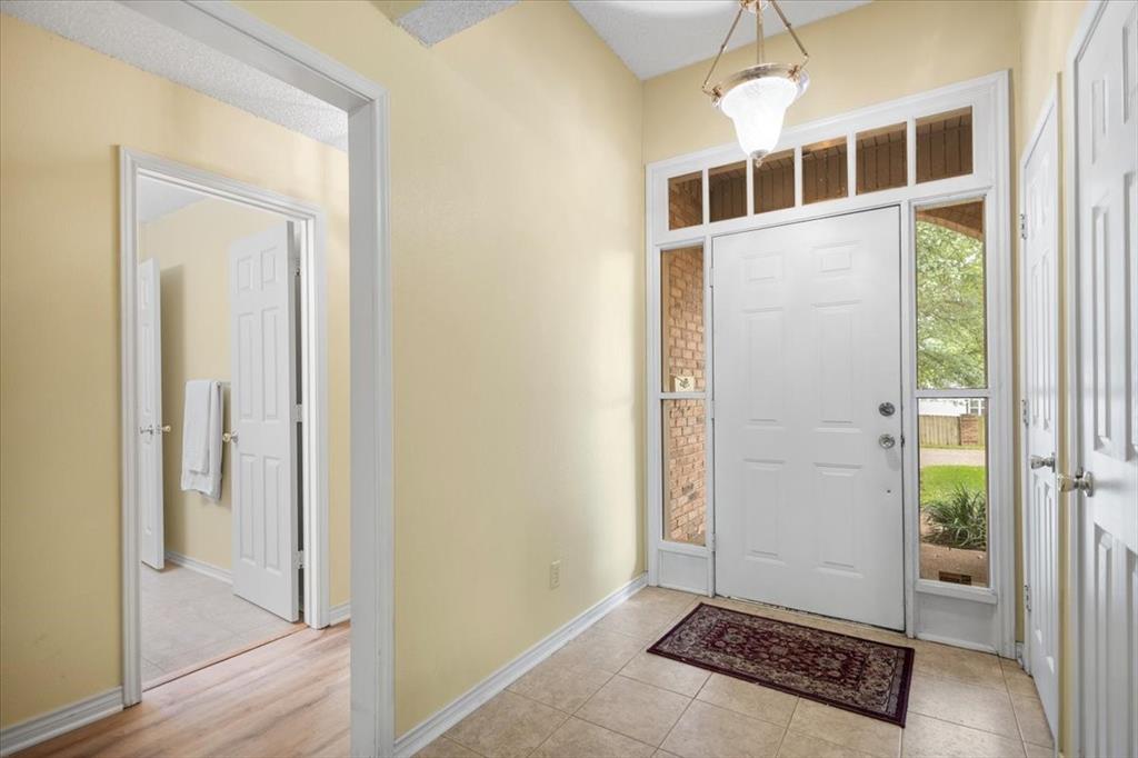 2824 Crestview Avenue Tyler, TX 75701 - Photo 5 of 39 a view of a room with wooden floor and windows