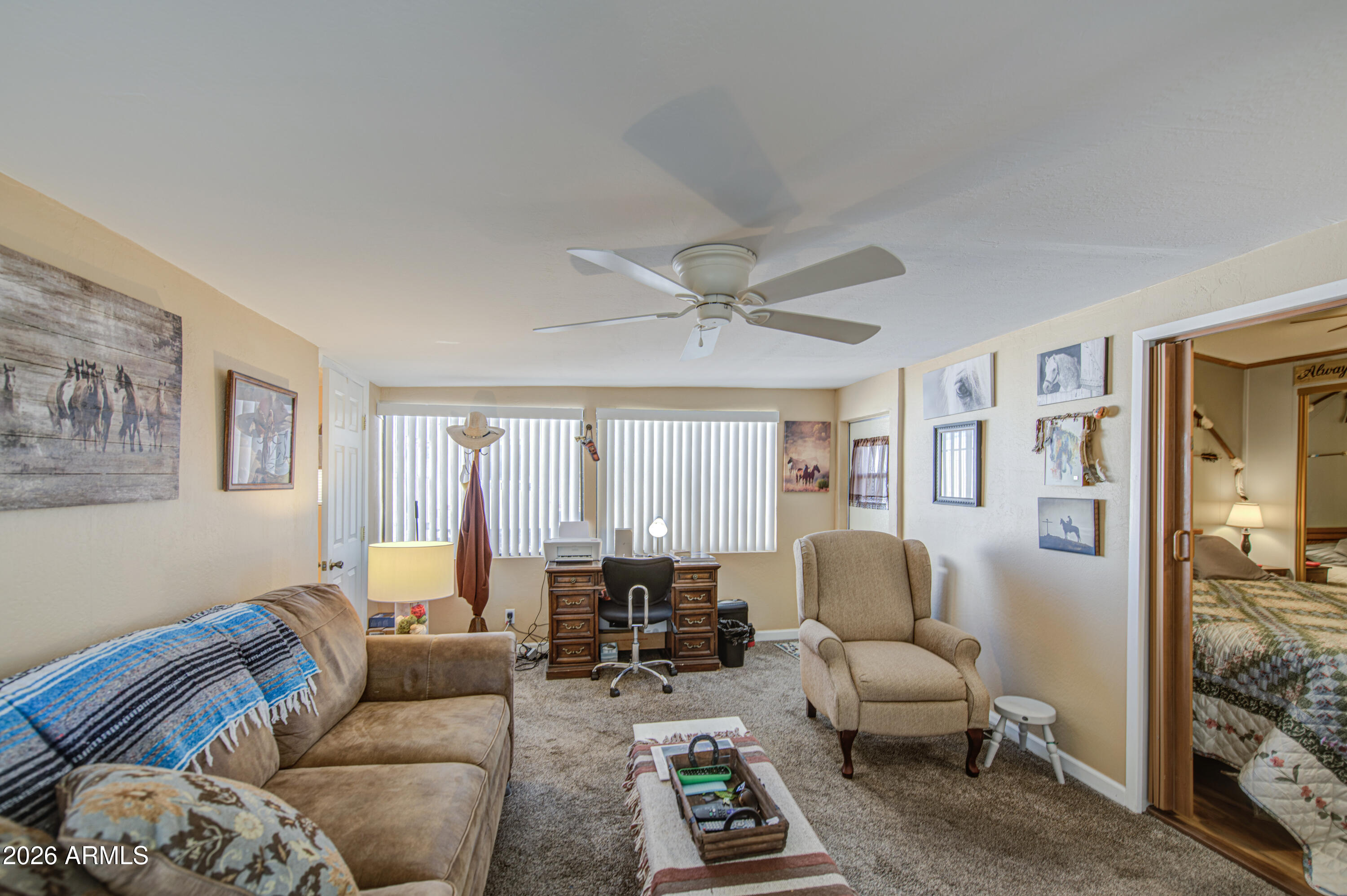 7750 East Broadway Road, Unit 463 Mesa, AZ 85208 - Photo 15 of 36 a living room with furniture and a large window