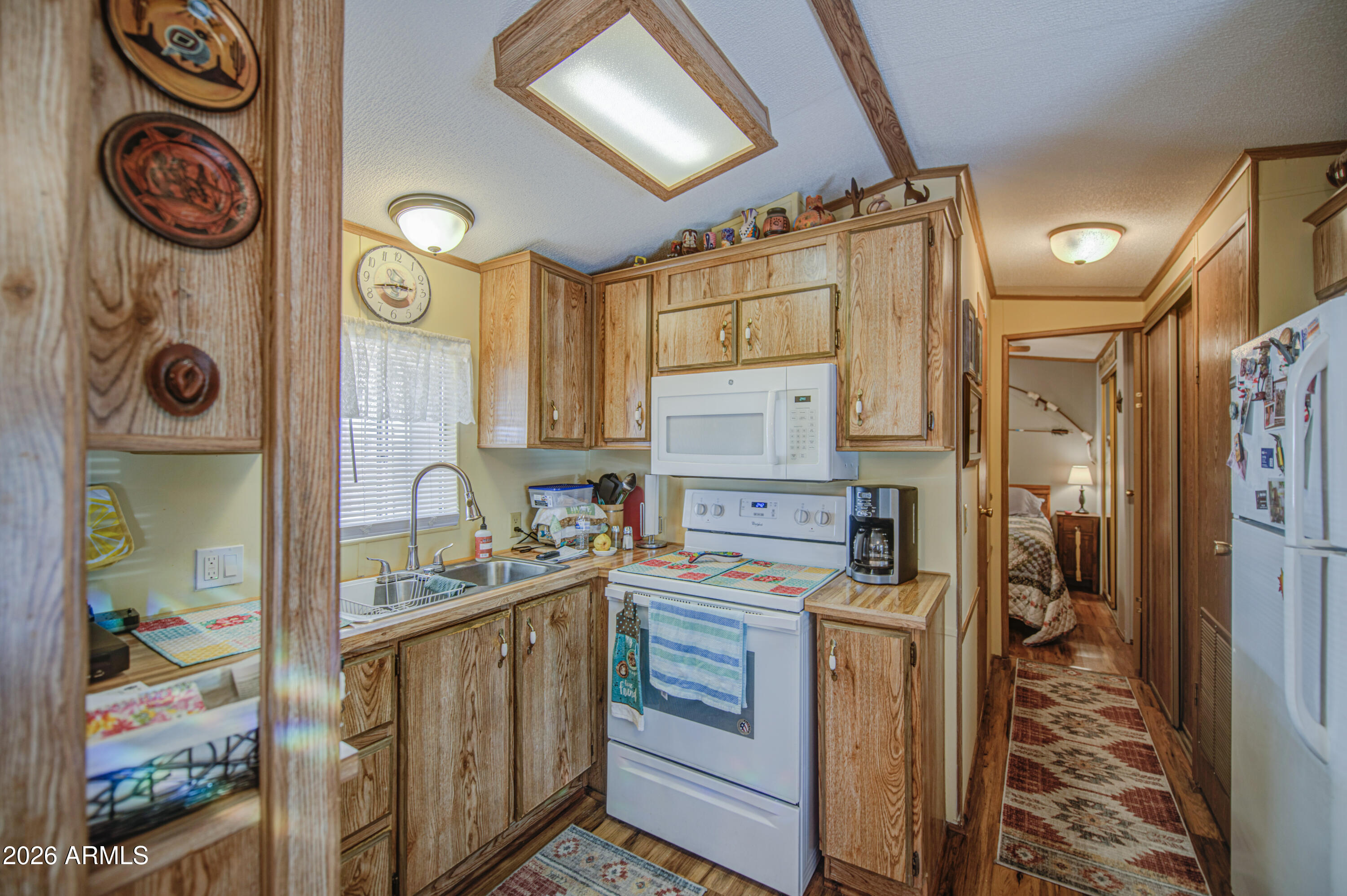 7750 East Broadway Road, Unit 463 Mesa, AZ 85208 - Photo 2 of 36 a utility room with dryer and washer