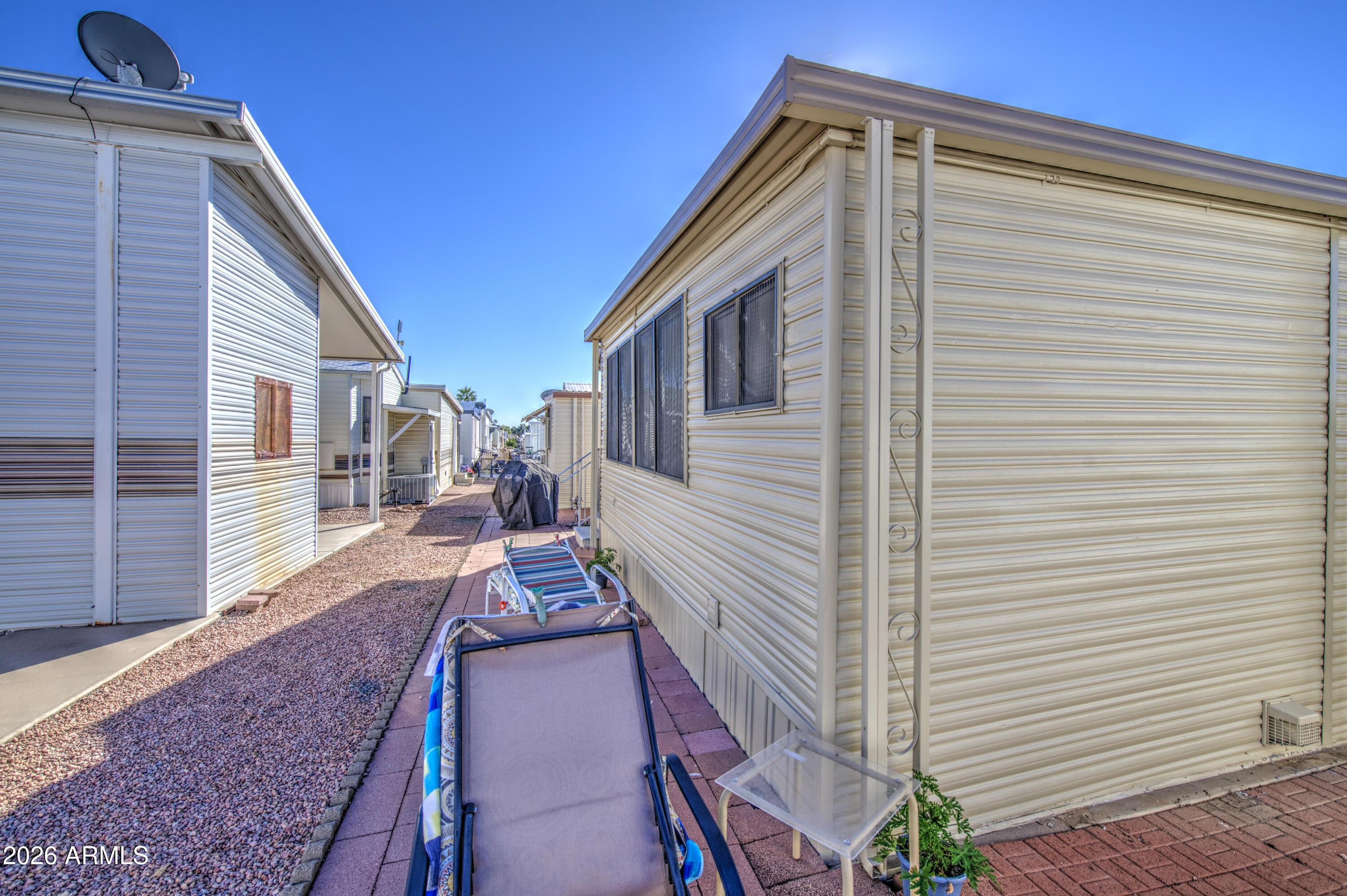 7750 East Broadway Road, Unit 463 Mesa, AZ 85208 - Photo 23 of 36 a view of a house with a yard