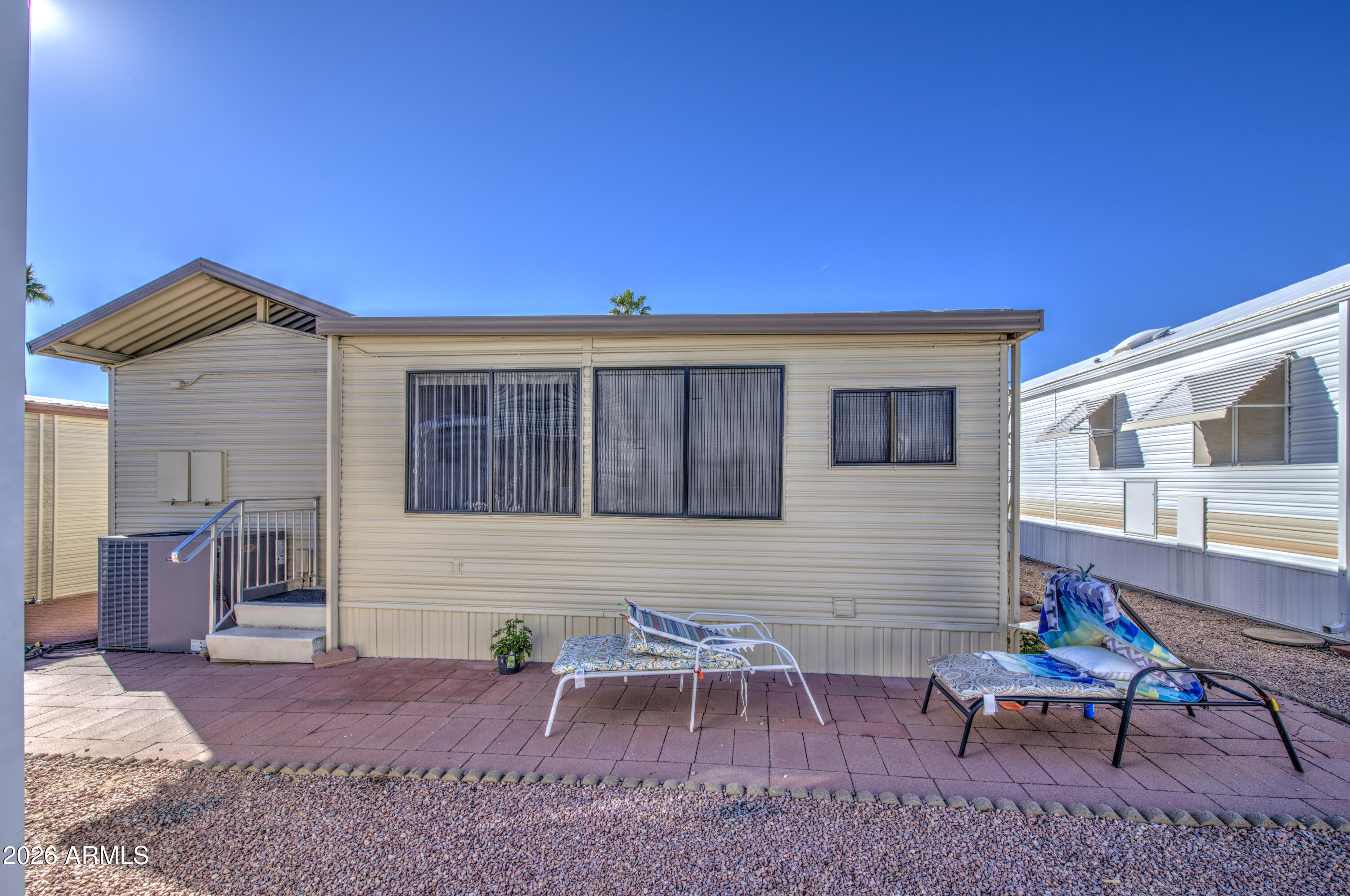 7750 East Broadway Road, Unit 463 Mesa, AZ 85208 - Photo 25 of 36 a view of a house with backyard