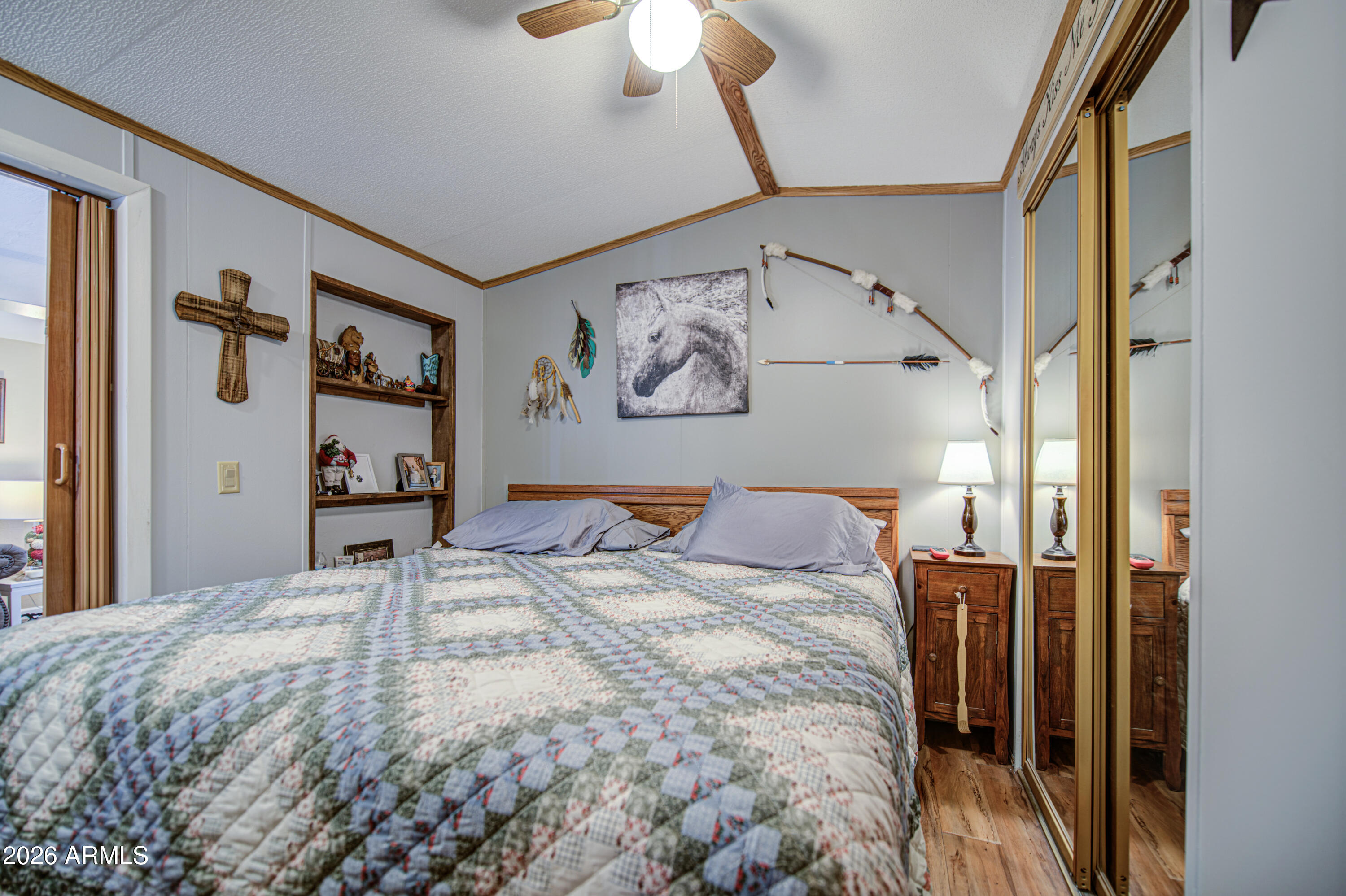 7750 East Broadway Road, Unit 463 Mesa, AZ 85208 - Photo 4 of 36 a bed sitting in a bedroom next to a window