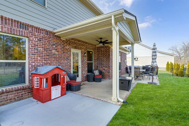 a backyard of a house with seating space