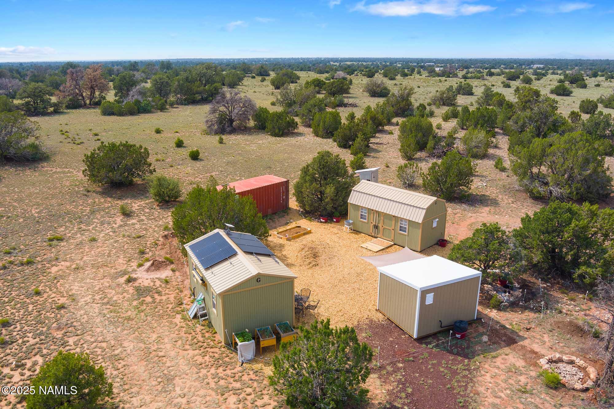 10448 South Rim Ranch Road Williams, AZ 86046 - Photo 3 of 60 an aerial view of a house with a yard