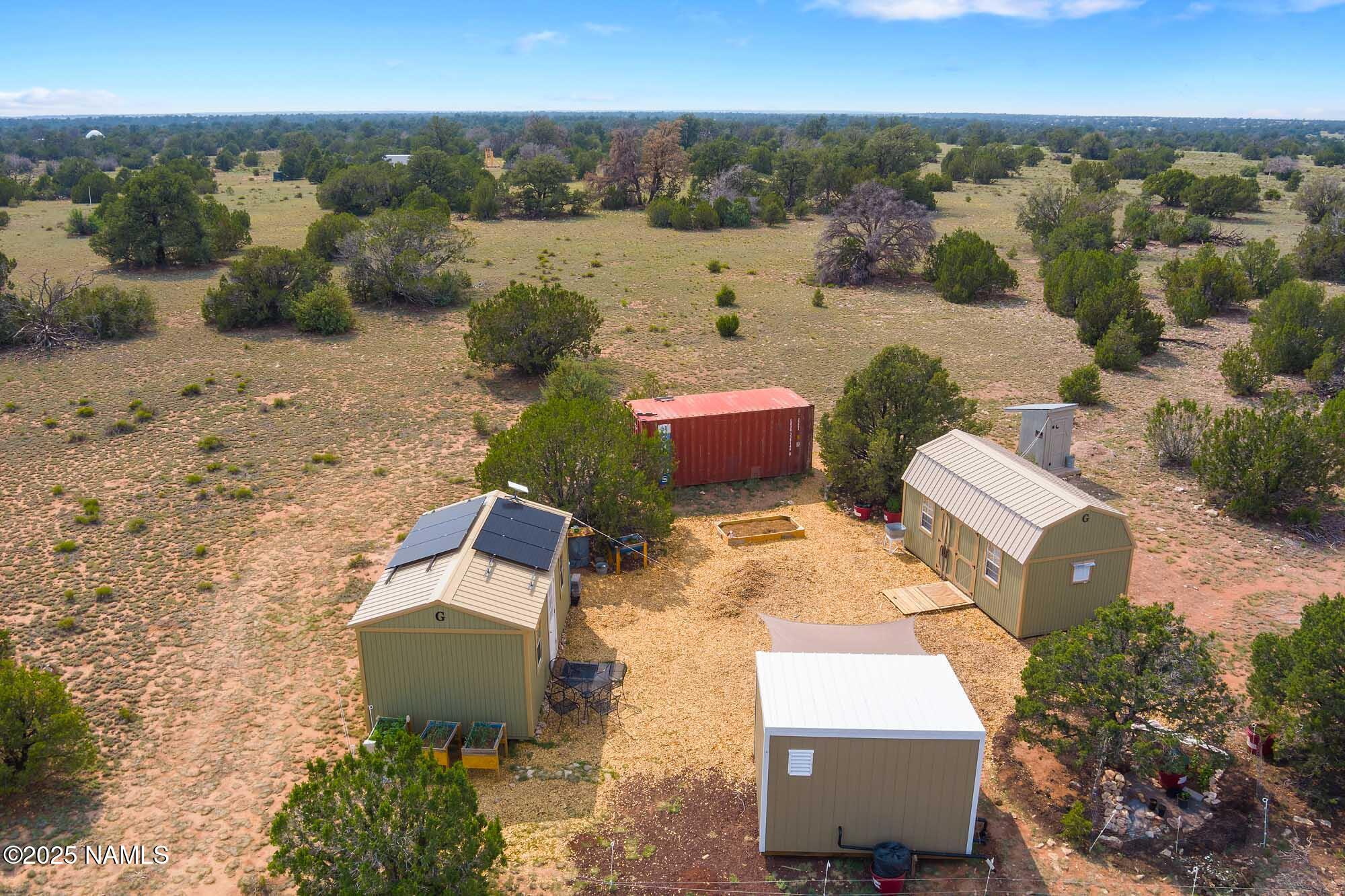 10448 South Rim Ranch Road Williams, AZ 86046 - Photo 6 of 60 an aerial view of a house with a yard