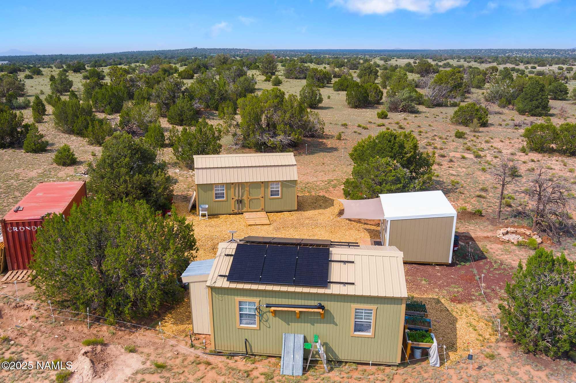 10448 South Rim Ranch Road Williams, AZ 86046 - Photo 7 of 60 an aerial view of a house with a yard