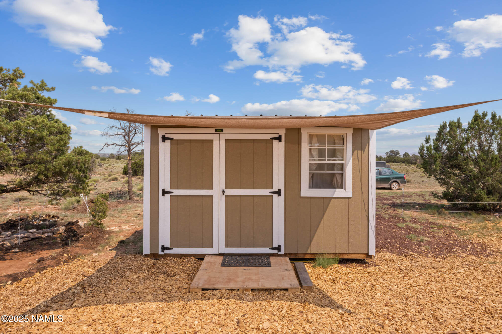10448 South Rim Ranch Road Williams, AZ 86046 - Photo 10 of 60 a view of a house with a door