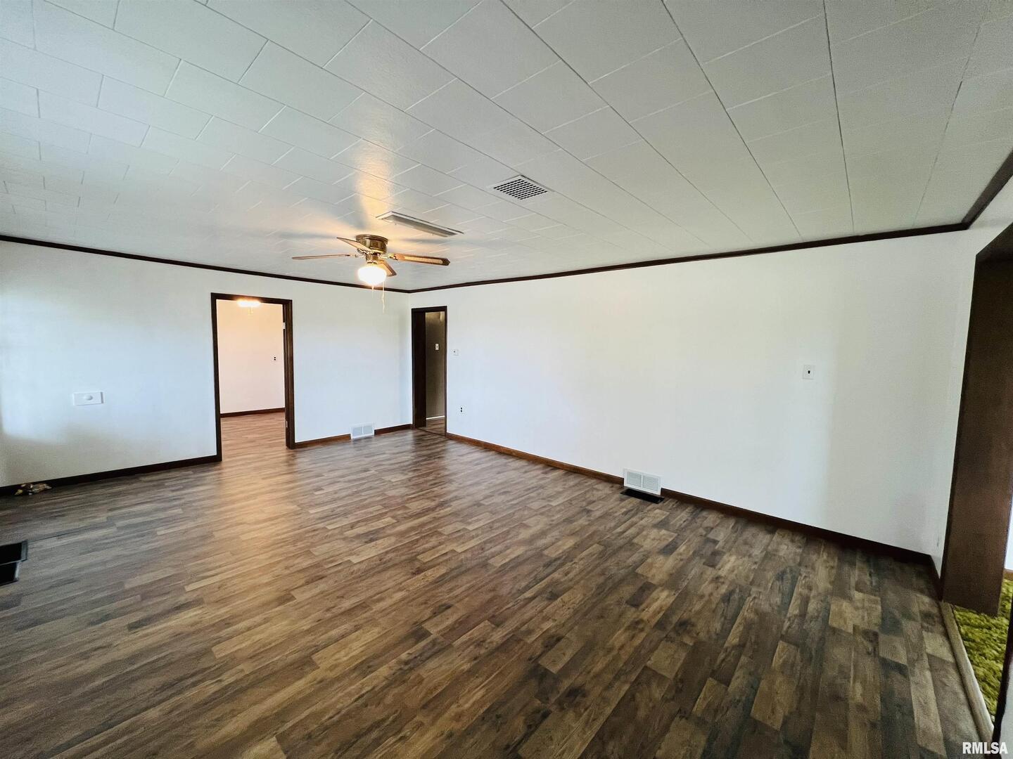17064 Old Frankfort Road Johnston City, IL 62951 - Photo 27 of 59 a view of an empty room with wooden floor