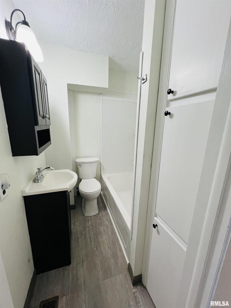 17064 Old Frankfort Road Johnston City, IL 62951 - Photo 31 of 59 a bathroom with a sink toilet and shower