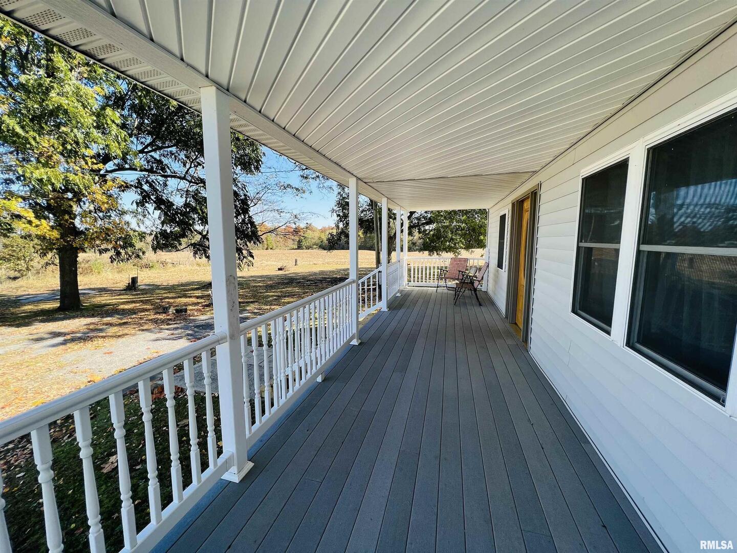 17064 Old Frankfort Road Johnston City, IL 62951 - Photo 9 of 59 a view of a balcony with wooden floor