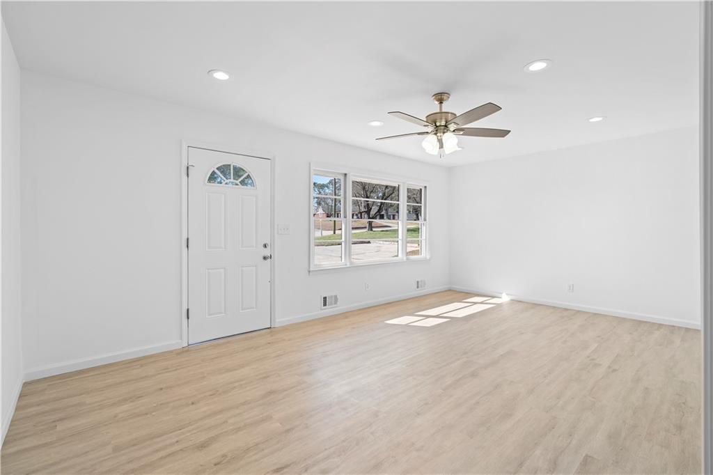 1802 Lake Harbin Road Morrow, GA 30260 - Photo 13 of 40 wooden floor in an empty room with a window