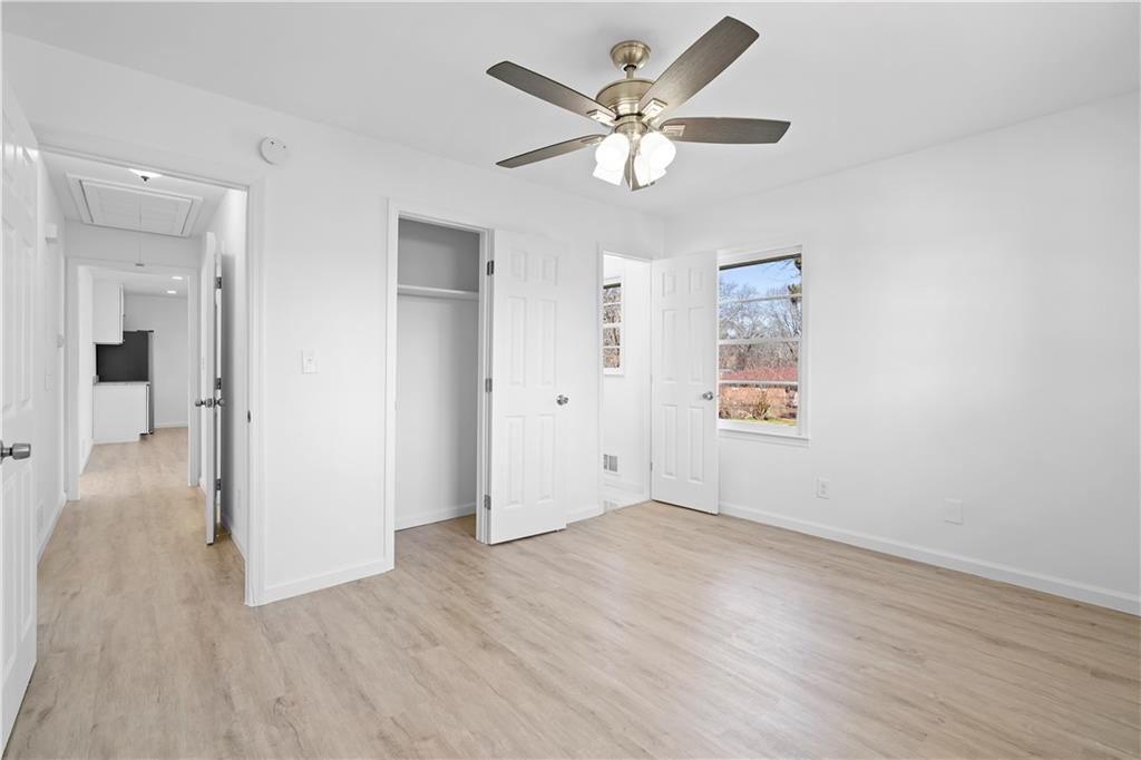 1802 Lake Harbin Road Morrow, GA 30260 - Photo 18 of 40 wooden floor in an empty room with a window