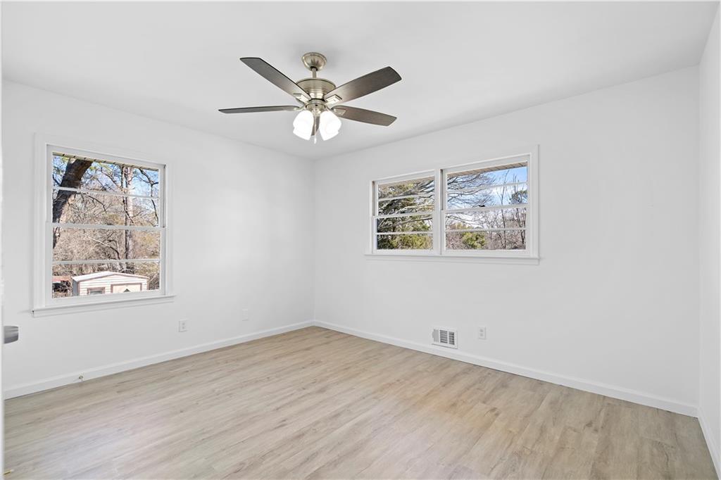 1802 Lake Harbin Road Morrow, GA 30260 - Photo 19 of 40 a view of a big room with wooden floor and windows