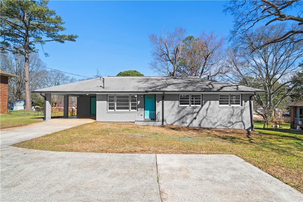 1802 Lake Harbin Road Morrow, GA 30260 - Photo 2 of 40 a view of a house with a outdoor space