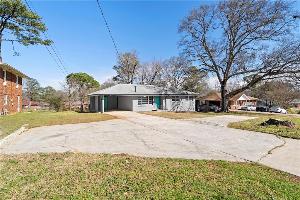 1802 Lake Harbin Road Morrow, GA 30260 - Photo 4 of 40 a front view of a building with tree s