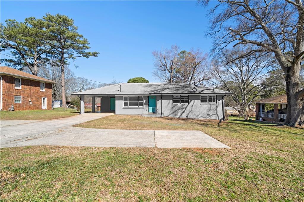 1802 Lake Harbin Road Morrow, GA 30260 - Photo 5 of 40 a front view of a house with a garden