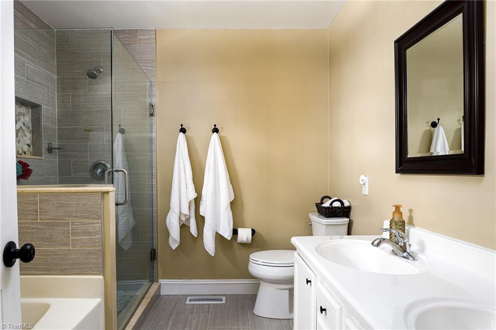 7169 Spring Hill Road Lewisville, NC 27023 - Photo 15 of 28 Walk-in shower, bathtub and double vanity