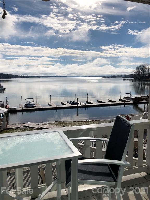 7831 Spinnaker Bay Drive, Unit 211 Sherrills Ford, NC 28673 - Photo 1 of 24 a view of a chairs and table on the terrace