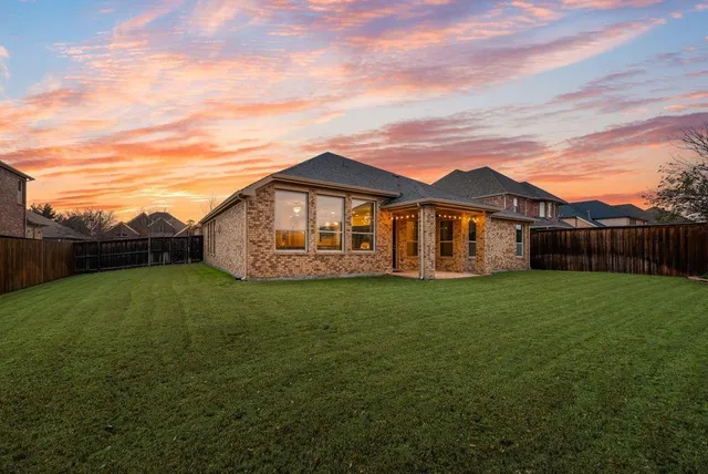 a view of a backyard of the house