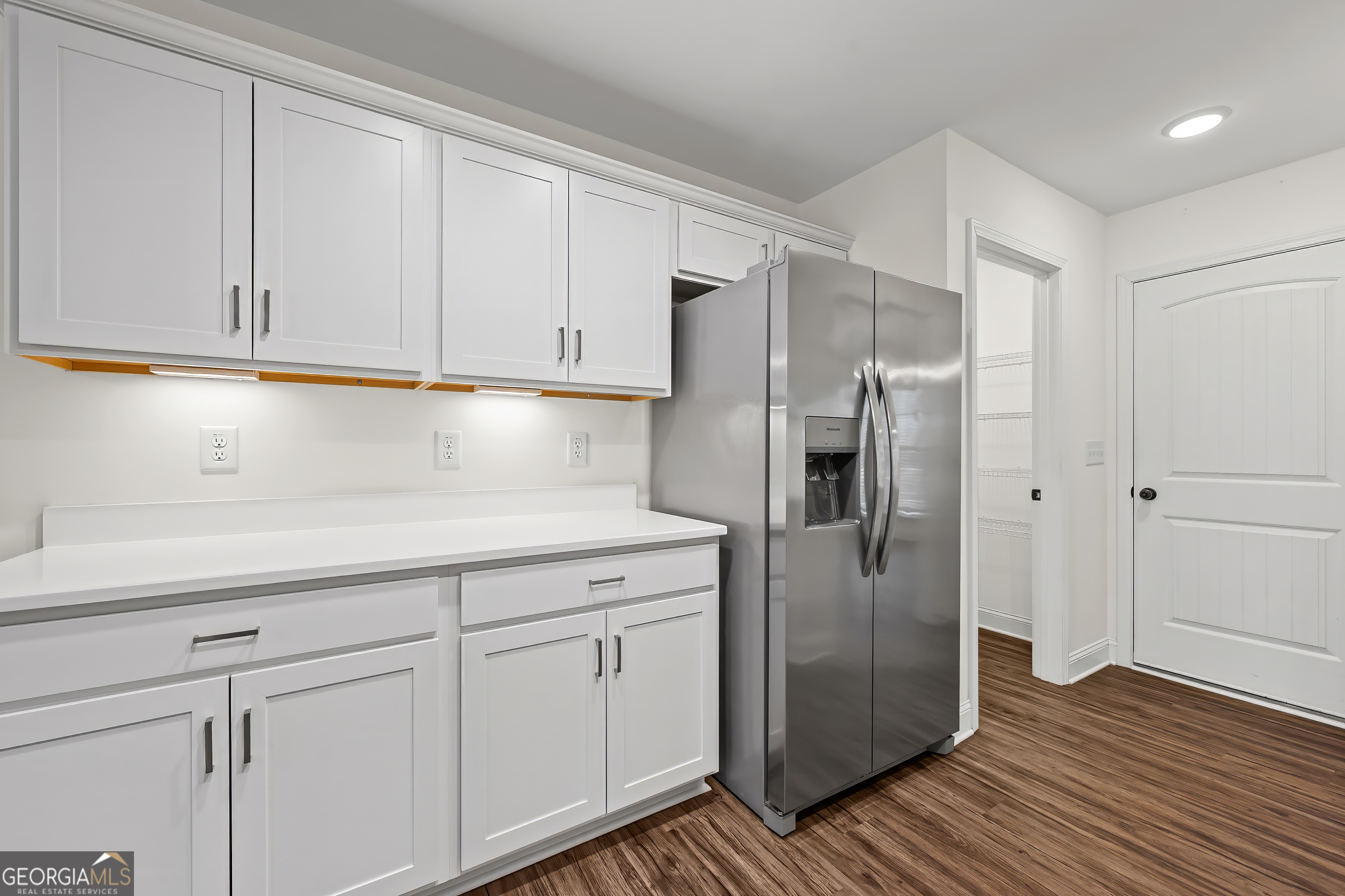 1788 Standing Rock Road Senoia, GA 30276 - Photo 14 of 36 a kitchen with a refrigerator and cabinets