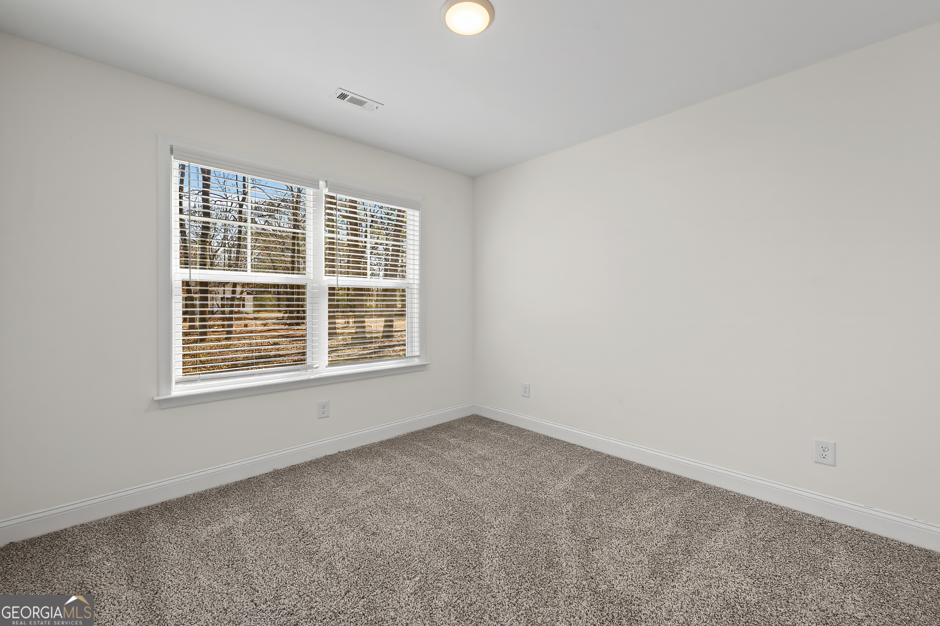1788 Standing Rock Road Senoia, GA 30276 - Photo 16 of 36 an empty room with a window