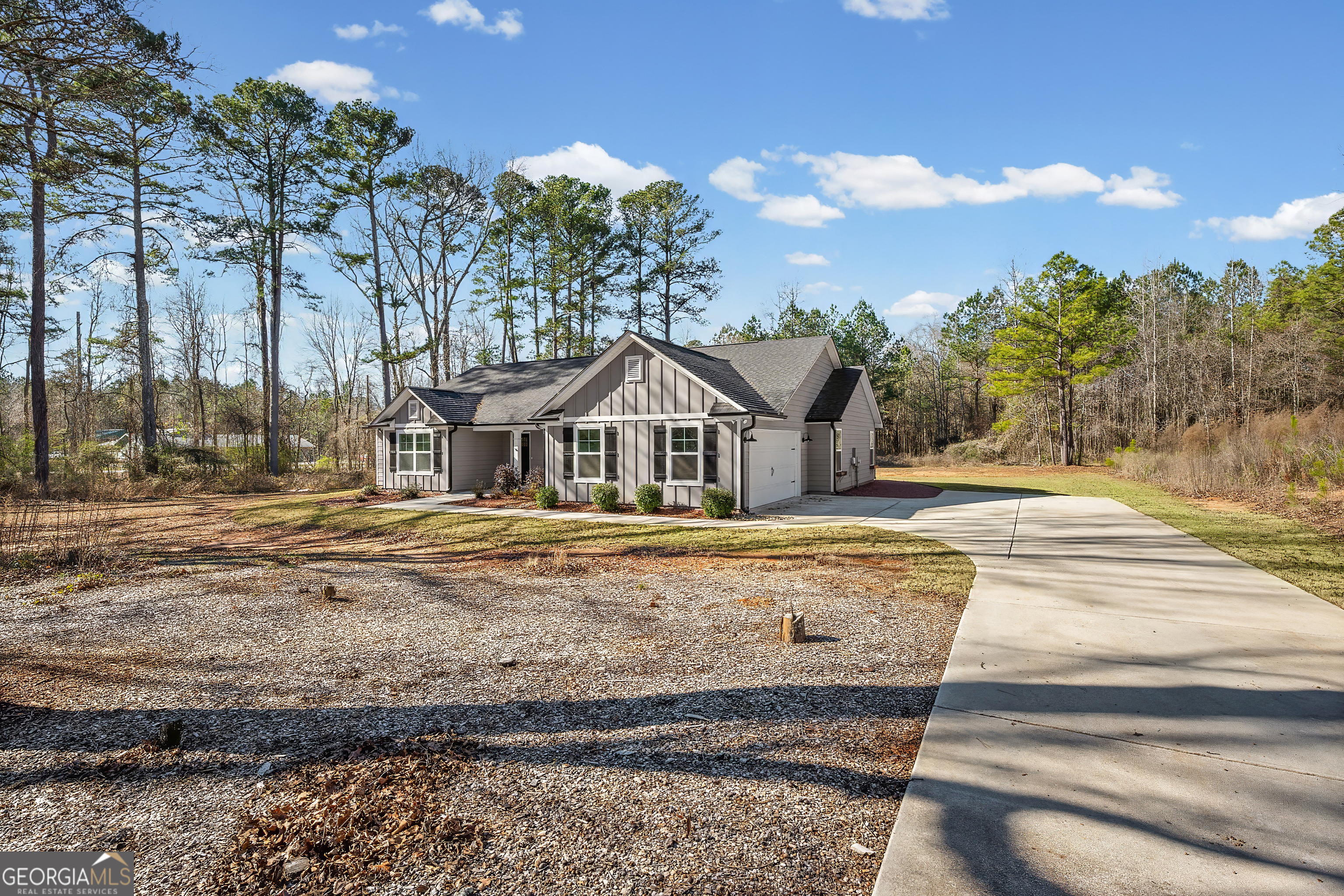 1788 Standing Rock Road Senoia, GA 30276 - Photo 2 of 36 a front view of a house with a yard