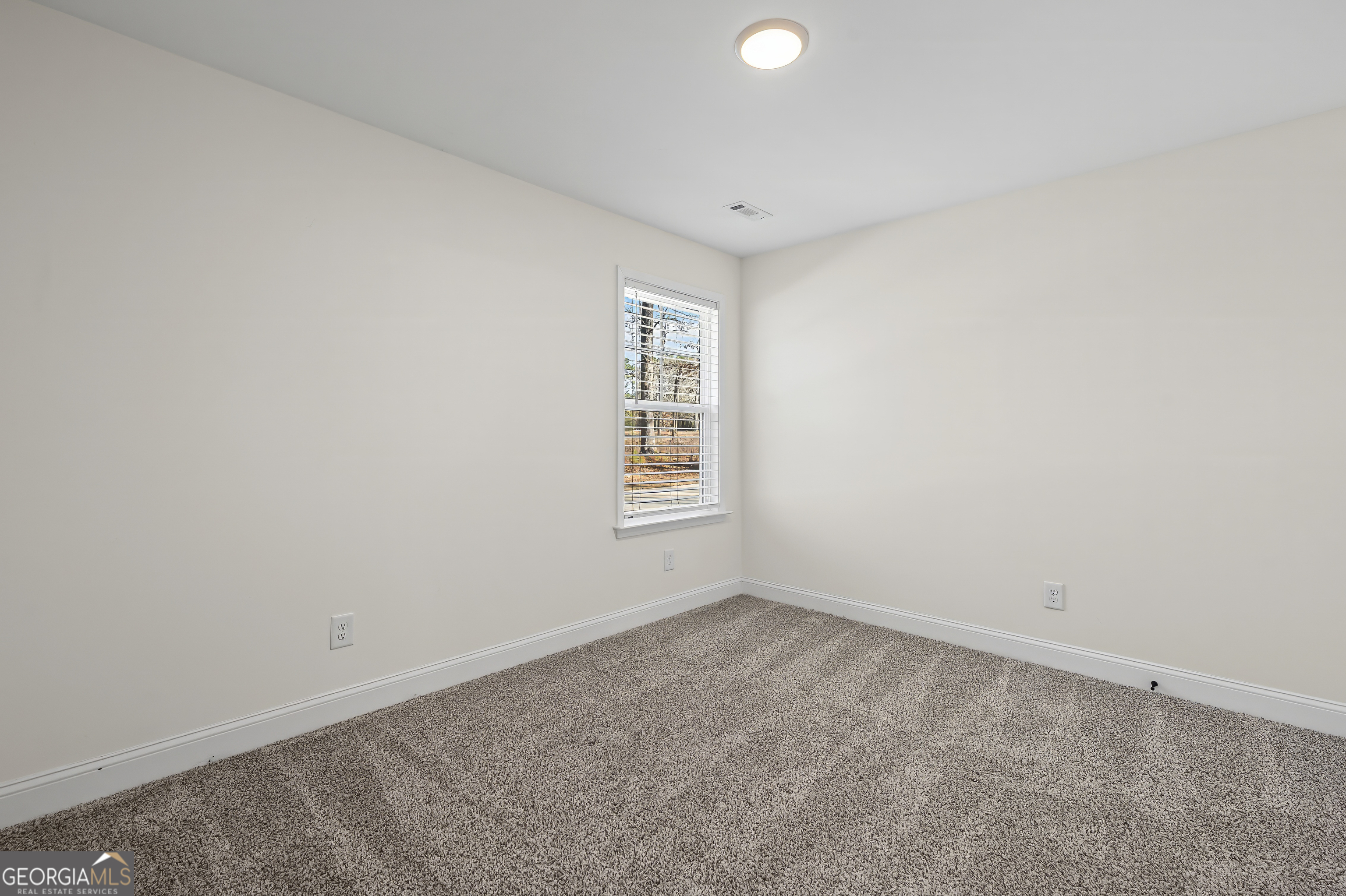 1788 Standing Rock Road Senoia, GA 30276 - Photo 23 of 36 an empty room with a window