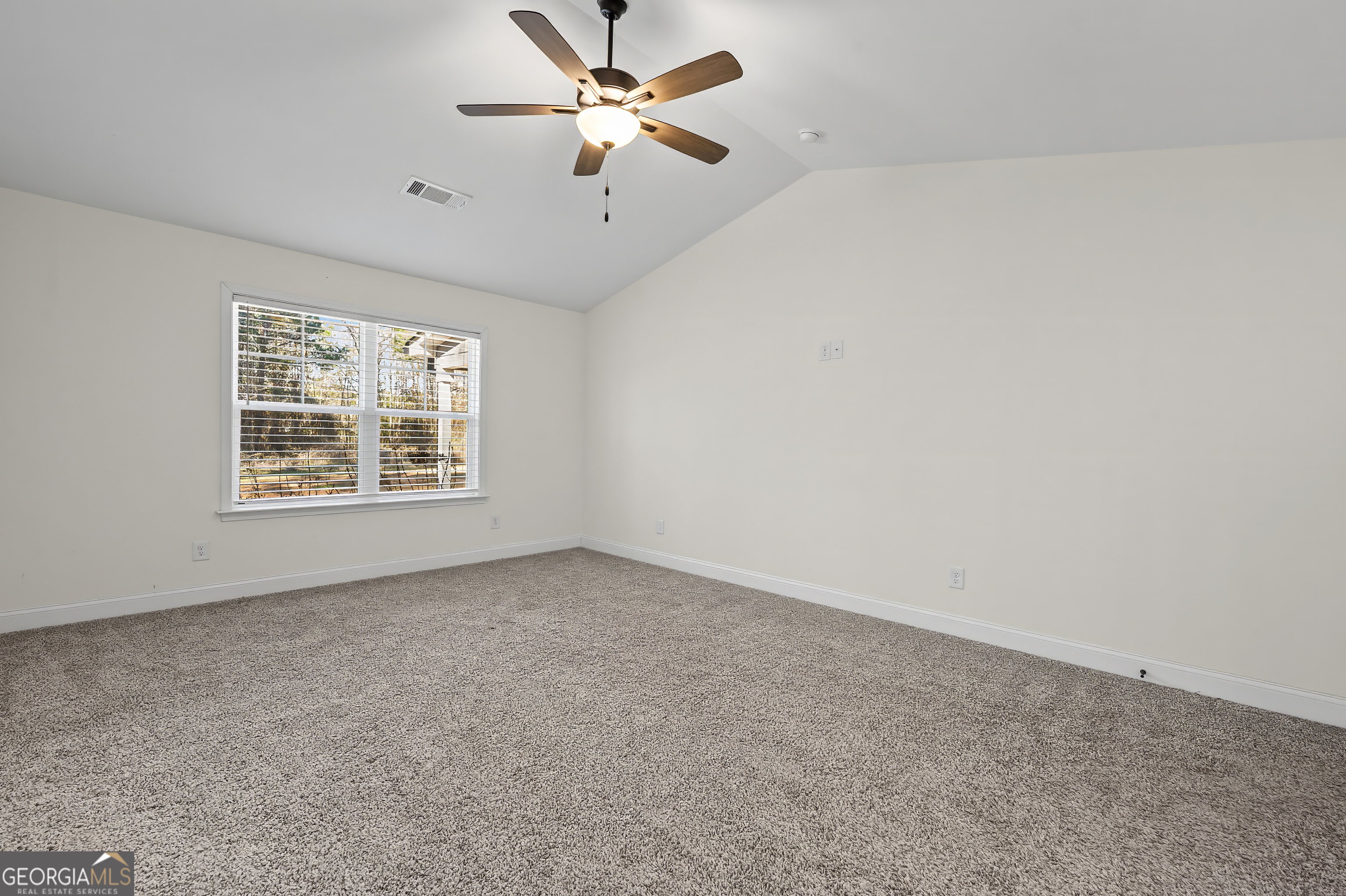 1788 Standing Rock Road Senoia, GA 30276 - Photo 28 of 36 an empty room with windows and fan