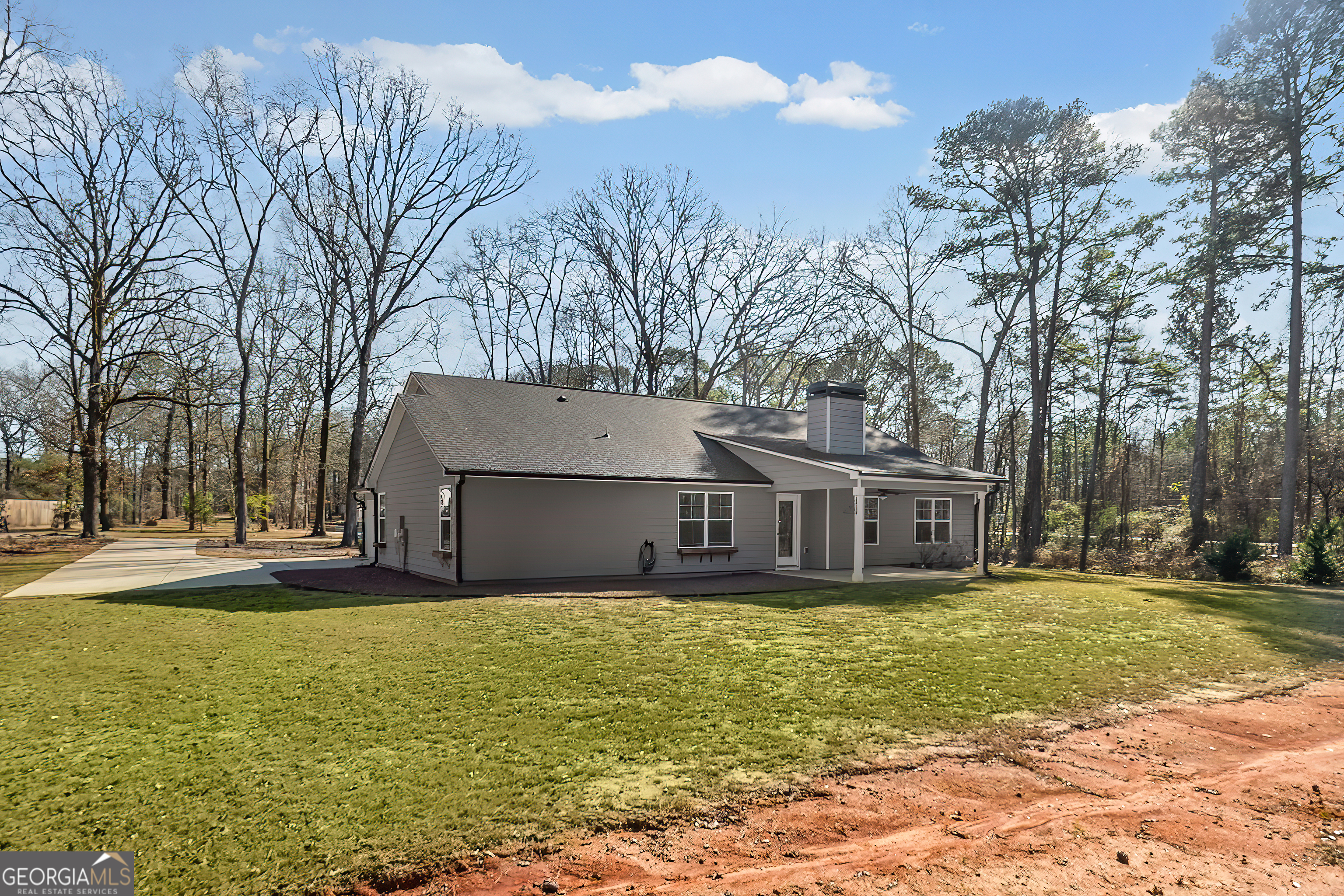 1788 Standing Rock Road Senoia, GA 30276 - Photo 33 of 36 a view of a house with a big yard and large trees