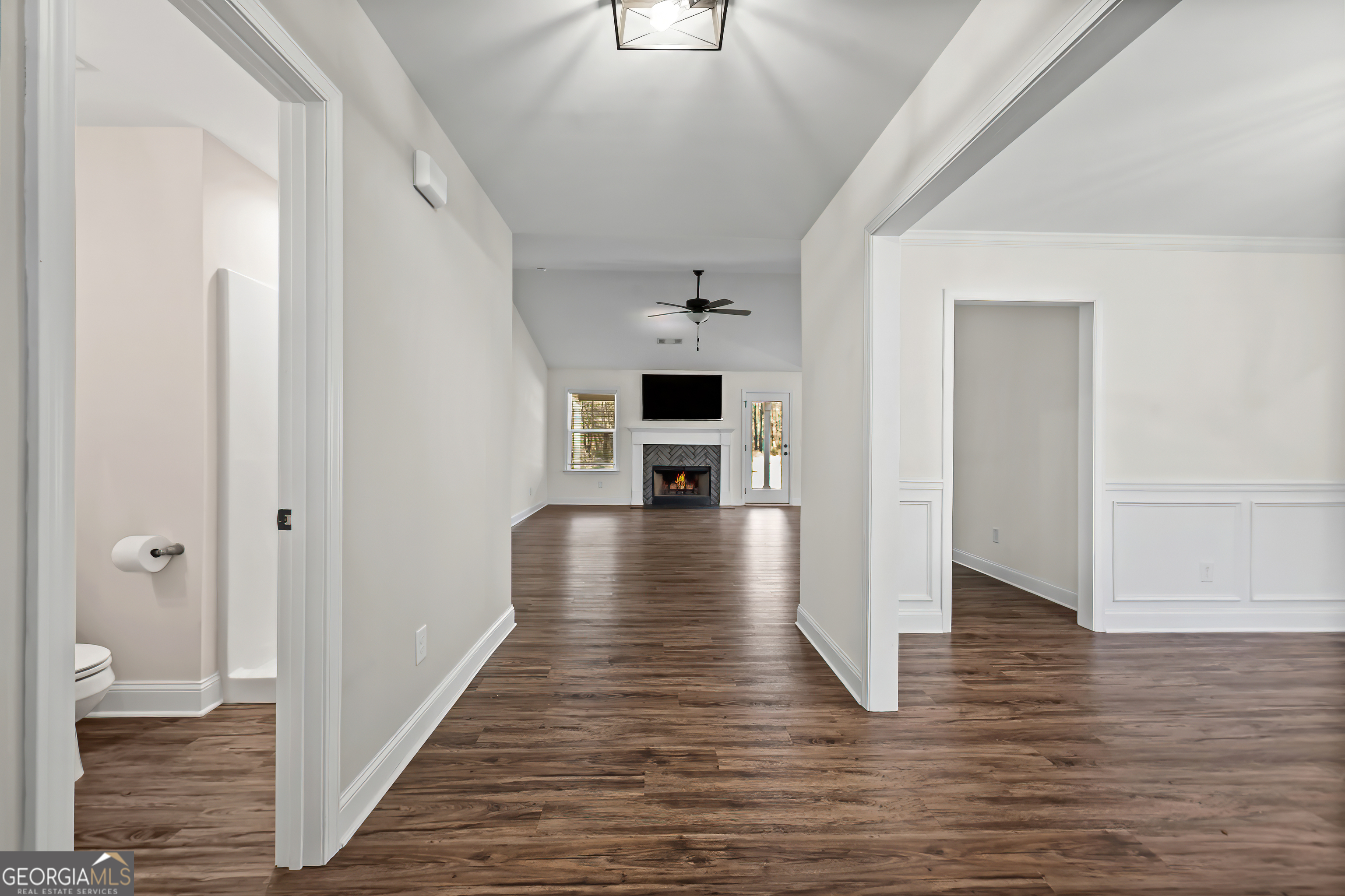 1788 Standing Rock Road Senoia, GA 30276 - Photo 5 of 36 a view of a hallway view with wooden floor and staircase