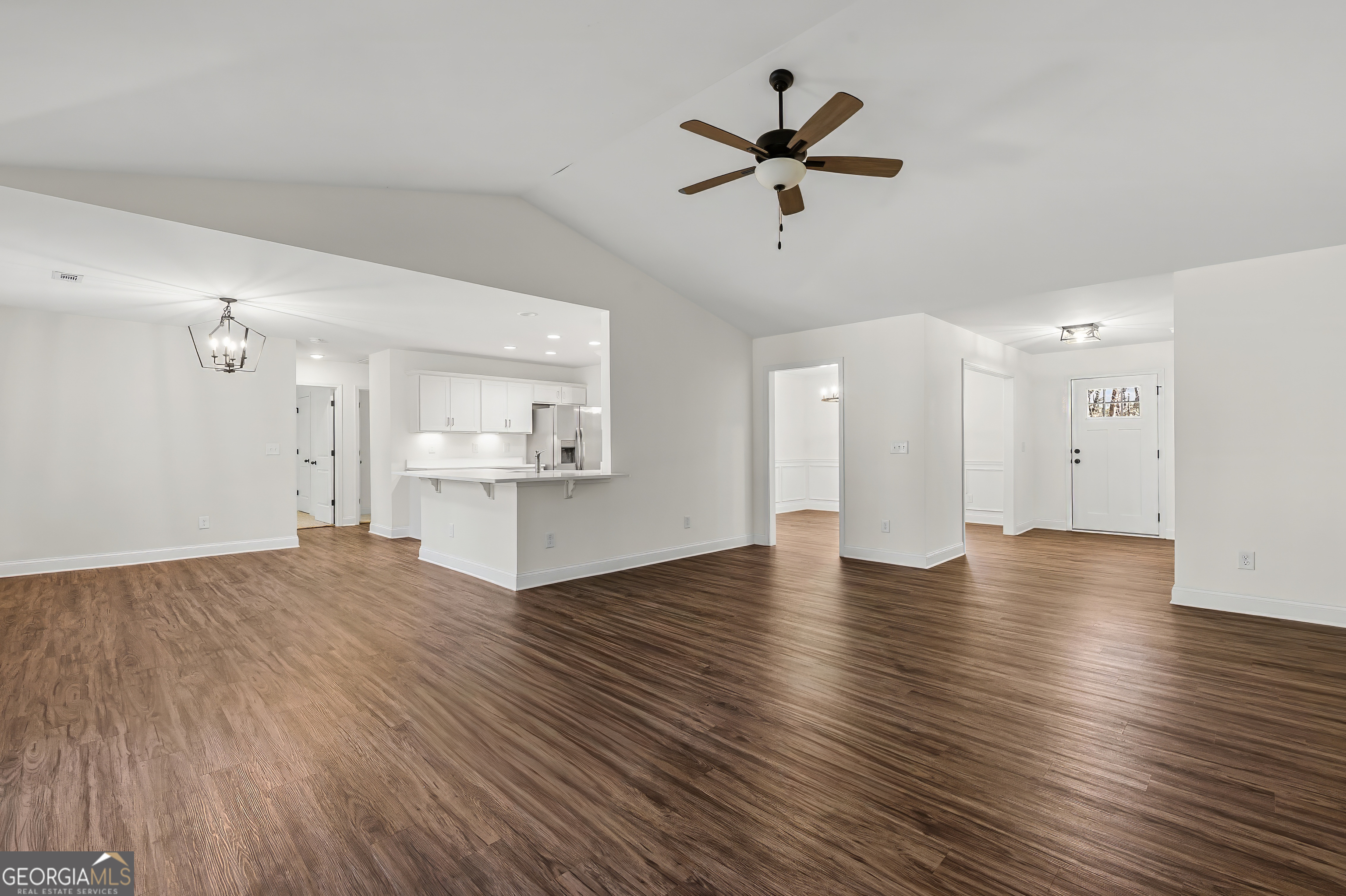 1788 Standing Rock Road Senoia, GA 30276 - Photo 10 of 36 a view of a kitchen with a dishwasher cabinets and wooden floor