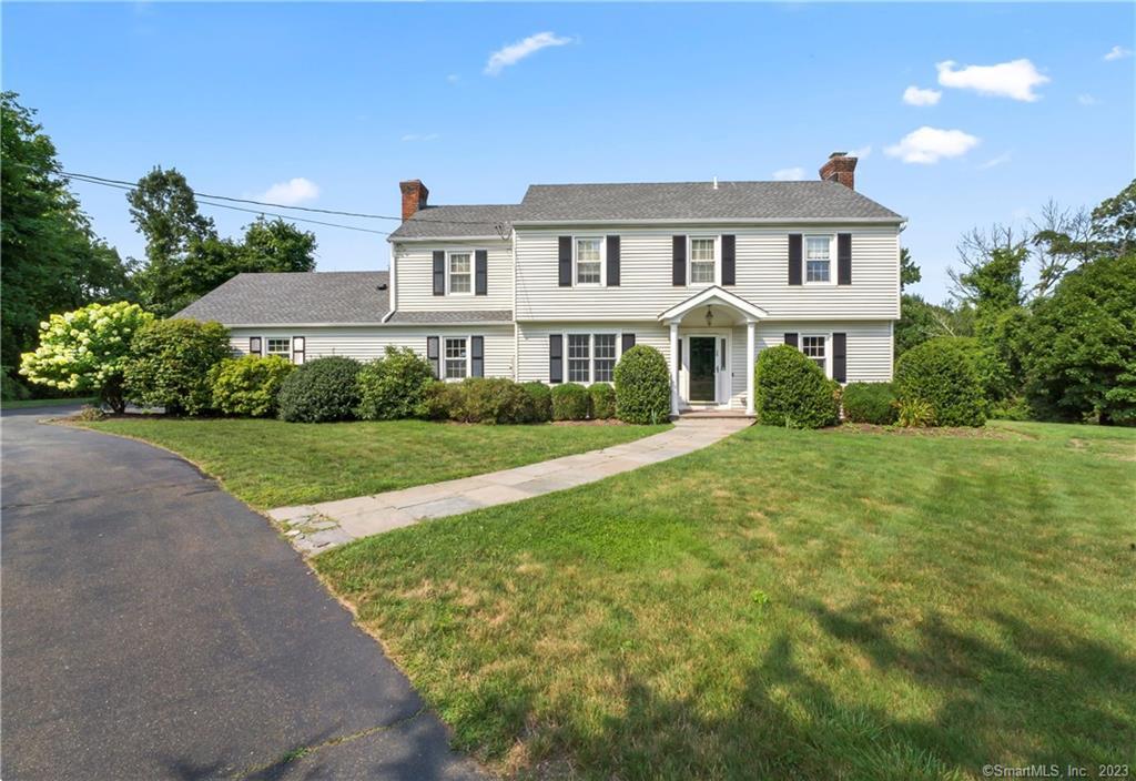 70 Powder Horn Drive Ridgefield, CT 06877 - Photo 1 of 1 a front view of a house with garden