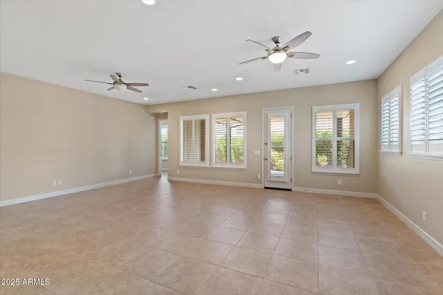 a kitchen with stainless steel appliances granite countertop a refrigerator a oven a sink and a stove