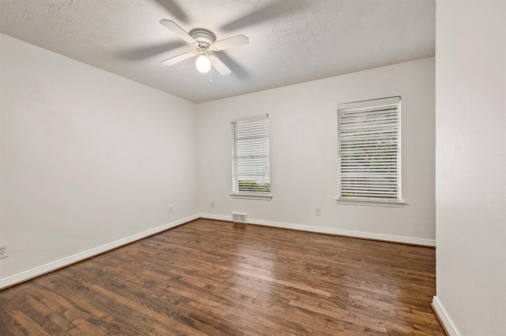 6644 Fisher Road Dallas, TX 75214 - Photo 16 of 21 wooden floor in an empty room with a window