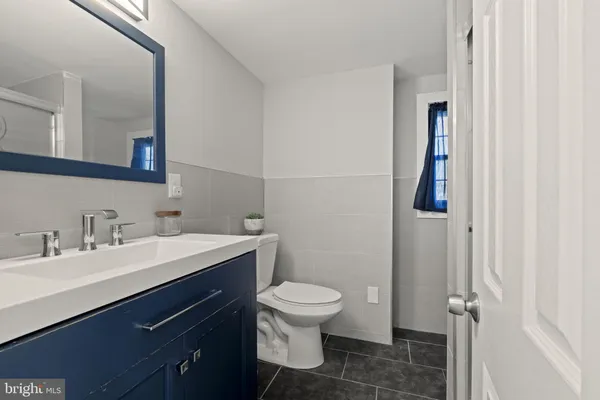 a bathroom with a glass shower door
