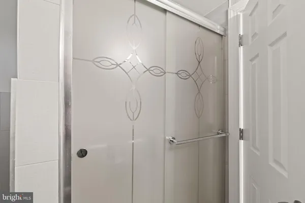 a living room with furniture a air conditioner vent and a window