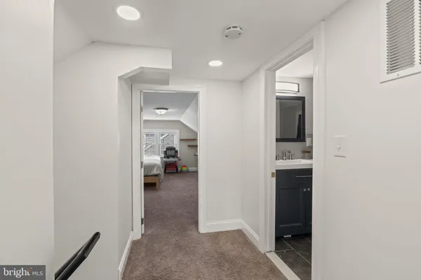 a view of yard covered with snow in front of house