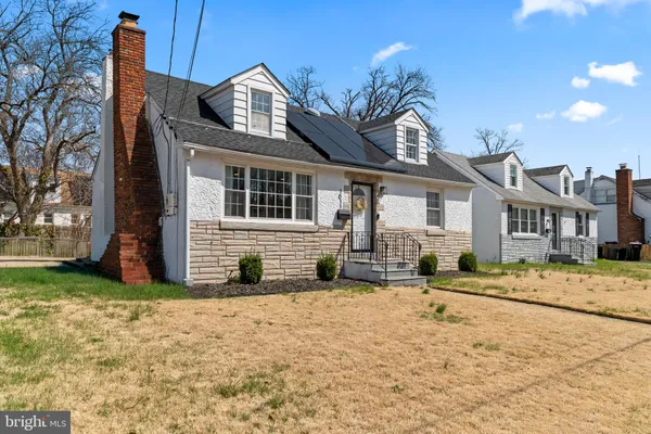 a view of a brick house with large windows
