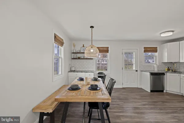 a view of a dining room with furniture window and wooden floor