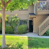 a view of an house with backyard and garden