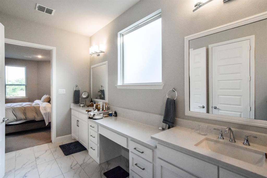 2516 Maidenhair Road Frisco, TX 75033 - Photo 11 of 30 a bathroom with a sink and a mirror